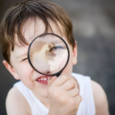 boy-looking-at-magnifying-glass-sq-400