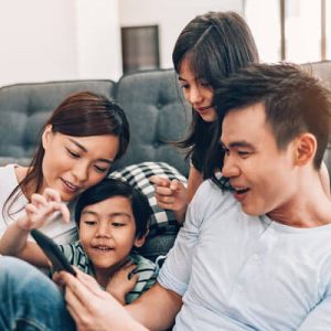 family-looking-at-phone-sq-400
