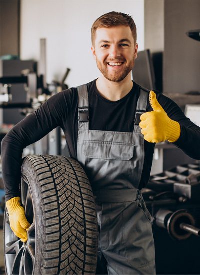 car-mechanic-changing-wheels-car